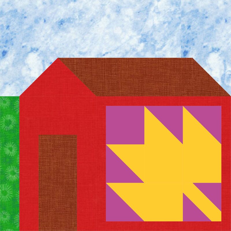 A barn quilt with a Maple Leaf quilt block on the side of the barn.